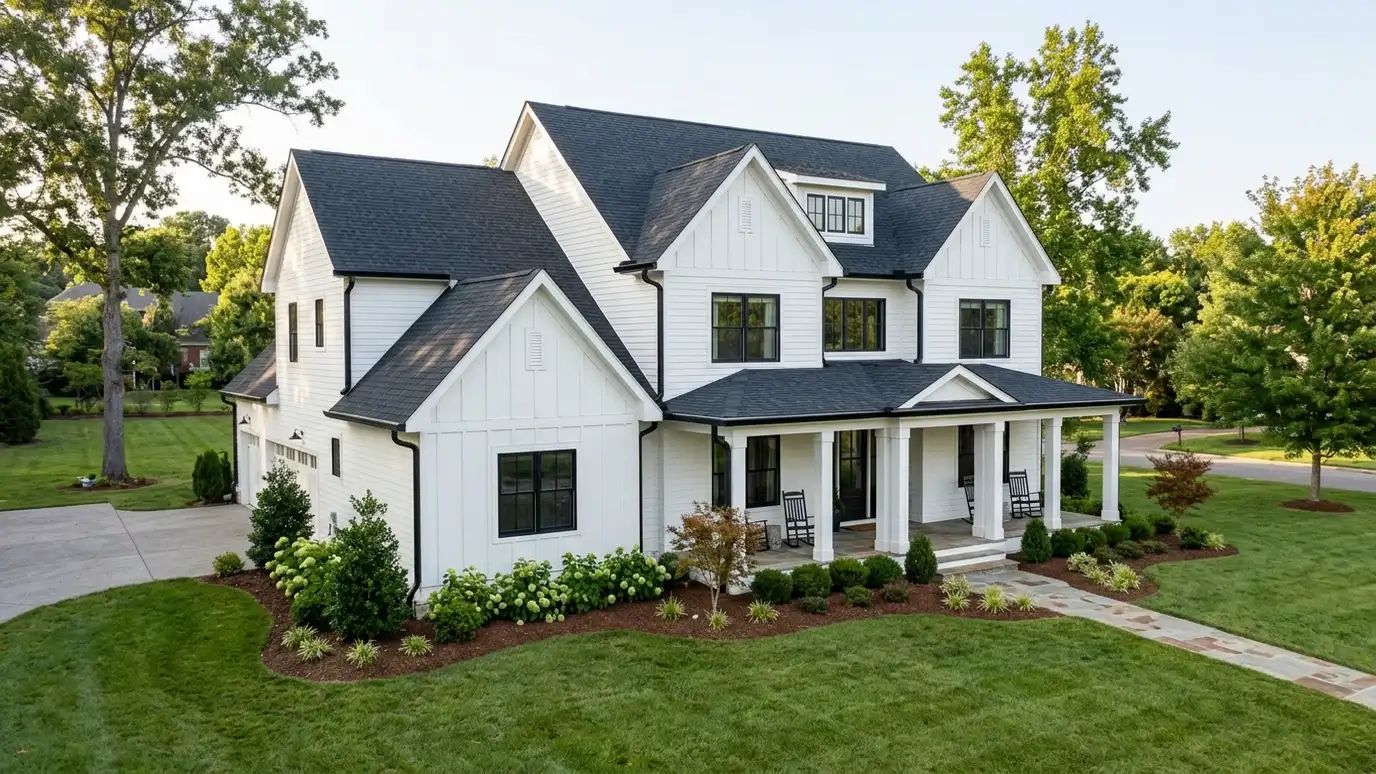 A beautiful home in Franklin, Tennessee with a new architectural shingle roof, clean gutters and a neat lawn in warm light