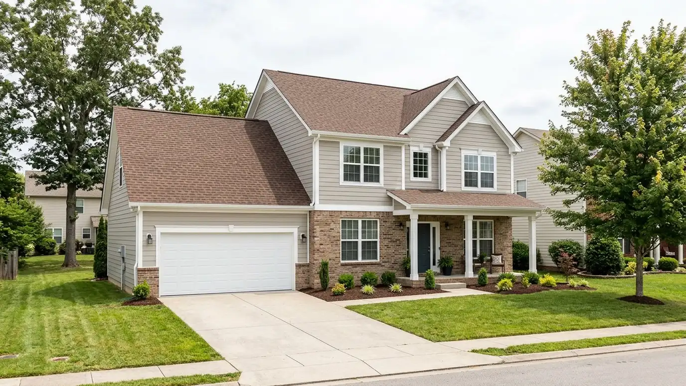 Roofing contractor in La Vergne, TN A beautiful home in La Vergne, Tennessee with a new architectural shingle roof, clean gutters and a neat lawn in warm light