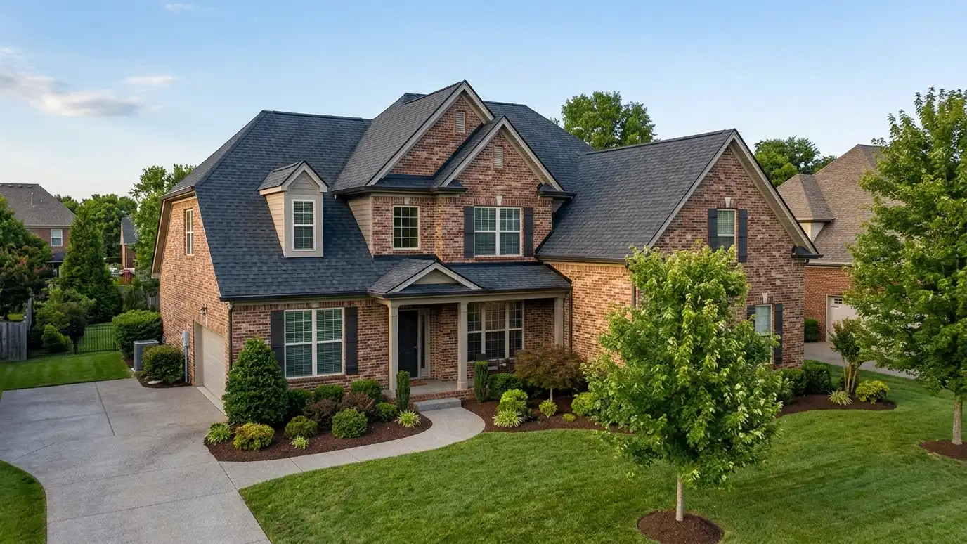 A beautiful home in Murfreesboro, Tennessee with a new architectural shingle roof, clean gutters and a neat lawn in warm light